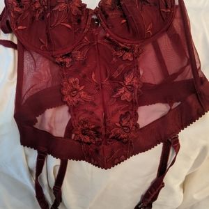 Woman's maroon corset with garters